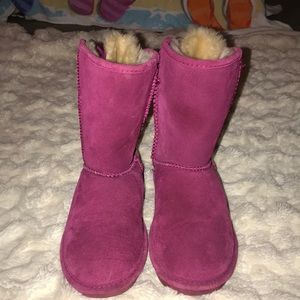 Pink bearpaw boots.